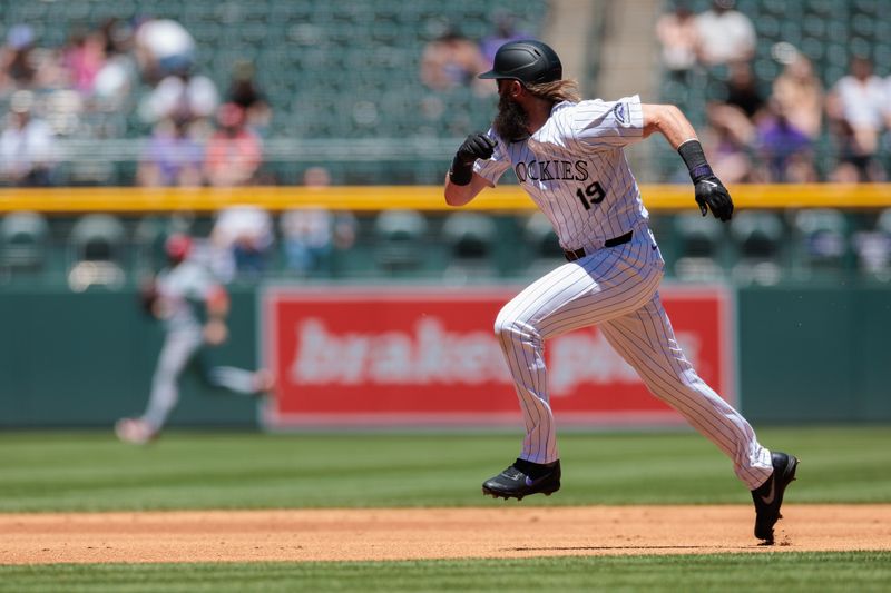 Jun 5, 2024; Denver, Colorado, USA; Colorado Rockies outfielder Charlie Blackmon (19) runs to third base during the first inning against the Cincinnati Reds at Coors Field. Mandatory Credit: Andrew Wevers-USA TODAY Sports