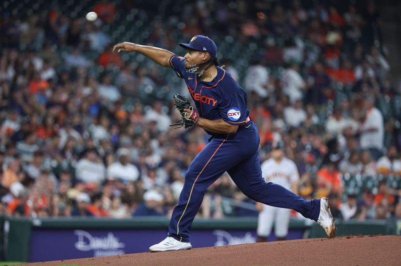 May 1, 2023; Houston, Texas, USA; Houston Astros starting pitcher Luis Garcia (77) delivers a pitch during the first inning aSan Francisco Giants at Minute Maid Park. Mandatory Credit: Troy Taormina-USA TODAY Sports