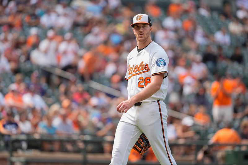 Aug 24, 2025; Baltimore, Maryland, USA; Baltimore Orioles pitcher Trevor Rogers (28) walks to the dugout in the middle of the seventh inning against the Houston Astros at Oriole Park at Camden Yards. Mandatory Credit: Gregory Fisher-Imagn Images