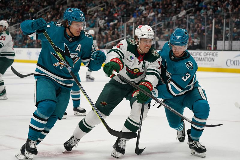 Apr 13, 2024; San Jose, California, USA; San Jose Sharks center Mikael Granlund (64), Minnesota Wild center Joel Eriksson Ek (14), and San Jose Sharks defenseman Henry Thrun (3) race to the puck during the first period at SAP Center at San Jose. Mandatory Credit: David Gonzales-USA TODAY Sports