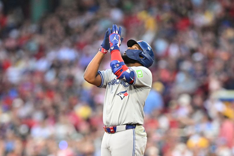 Jun 25, 2024; Boston, Massachusetts, USA; Toronto Blue Jays first baseman Vladimir Guerrero Jr. (27) reacts after hitting a two-run RBI double against the Boston Red Sox during the third inning at Fenway Park. Mandatory Credit: Brian Fluharty-USA TODAY Sports