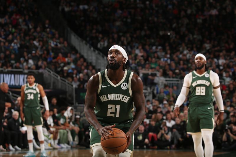 MILWAUKEE, WI - MARCH 24:  Patrick Beverley #21 of the Milwaukee Bucks shoots a free throw during the game against the Oklahoma City Thunder on March 24, 2024 at the Fiserv Forum Center in Milwaukee, Wisconsin. NOTE TO USER: User expressly acknowledges and agrees that, by downloading and or using this Photograph, user is consenting to the terms and conditions of the Getty Images License Agreement. Mandatory Copyright Notice: Copyright 2024 NBAE (Photo by Gary Dineen/NBAE via Getty Images).