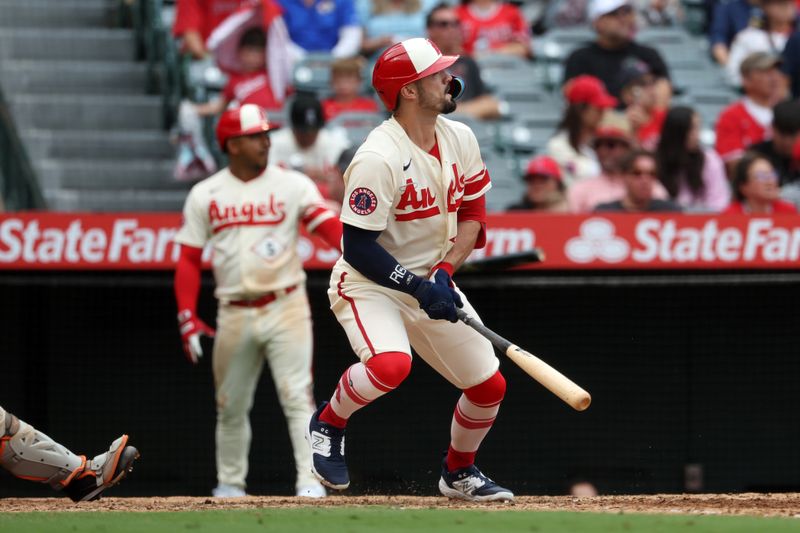 Sep 17, 2023; Anaheim, California, USA; Los Angeles Angels left fielder Randal Grichuk (15) hits a 2-run home run during the sixth inning against the Detroit Tigers at Angel Stadium. Mandatory Credit: Kiyoshi Mio-USA TODAY Sports