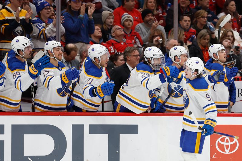 Nov 22, 2023; Washington, District of Columbia, USA; Buffalo Sabres left wing Zach Benson (9) celebrates with teammates after scoring a goal against the Washington Capitals in the first period at Capital One Arena. Mandatory Credit: Geoff Burke-USA TODAY Sports