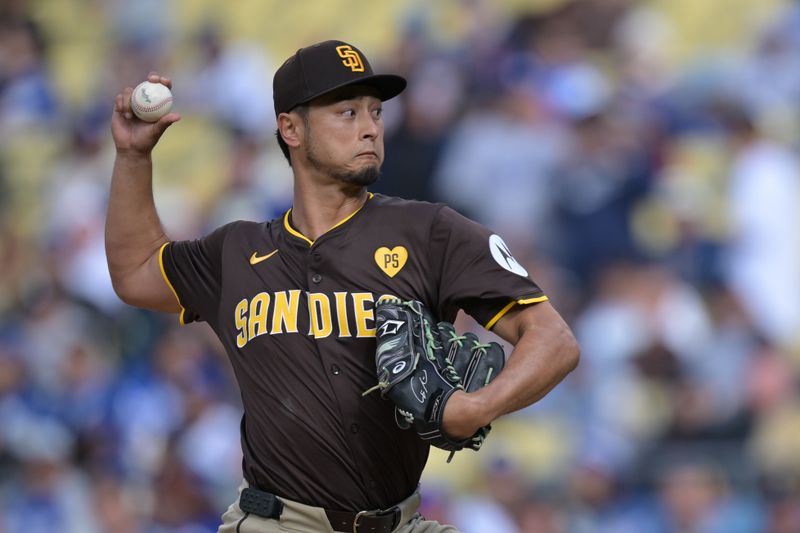 Apr 14, 2024; Los Angeles, California, USA; San Diego Padres pitcher Yu Darvish (11) throws to the plate in the second inning against the Los Angeles Dodgers at Dodger Stadium. Mandatory Credit: Jayne Kamin-Oncea-USA TODAY Sports