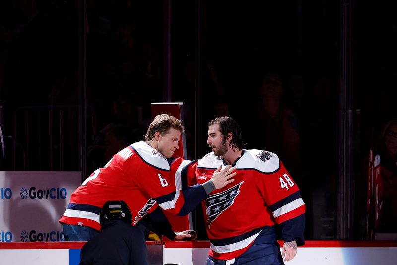 Nov 28, 2025; Washington, District of Columbia, USA; Washington Capitals defenseman Jakob Chychrun (6) shakes hands with Capitals goaltender Logan Thompson (48) after their game against the Toronto Maple Leafs at Capital One Arena. Mandatory Credit: Geoff Burke-Imagn Images