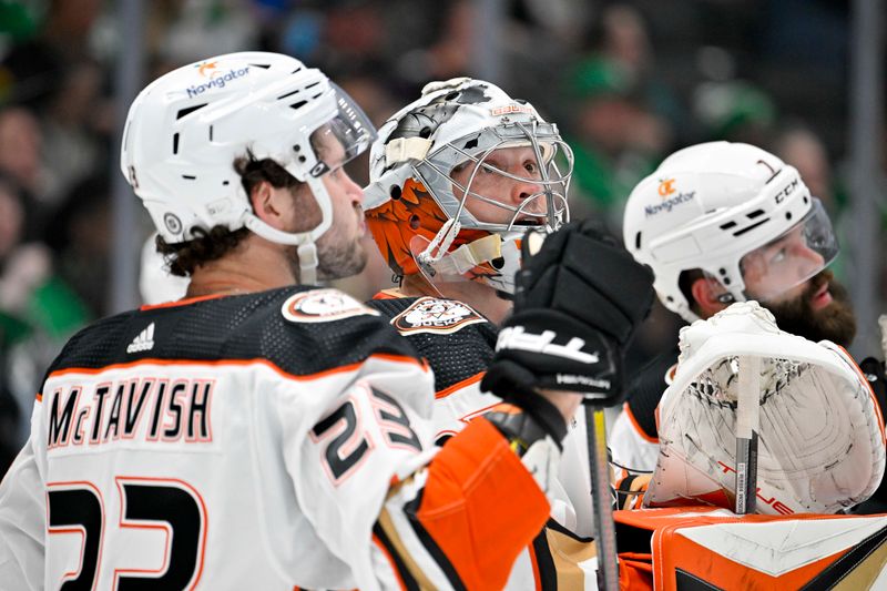 Jan 25, 2024; Dallas, Texas, USA; Anaheim Ducks center Mason McTavish (23) and Ducks goaltender John Gibson (36) and defenseman Radko Gudas (7) check the replay screen of Dallas Stars center Craig Smith (not pictured) shot on goal during the second period at the American Airlines Center. Mandatory Credit: Jerome Miron-USA TODAY Sports