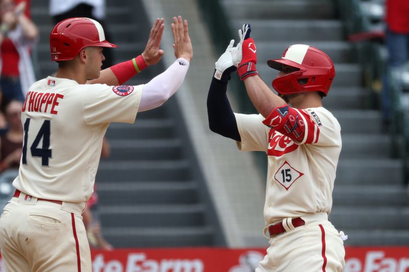 Sep 17, 2023; Anaheim, California, USA; Los Angeles Angels left fielder Randal Grichuk (15) is greeted by catcher Logan O'Hoppe (14) after hitting a two-run home run during the sixth inning against the Detroit Tigers at Angel Stadium. Mandatory Credit: Kiyoshi Mio-USA TODAY Sports