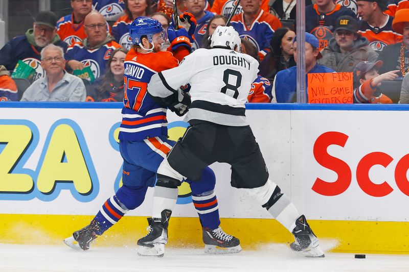 May 1, 2024; Edmonton, Alberta, CAN; Edmonton Oilers forward Connor McDavid (97) and Los Angeles Kings defensemen Drew Doughty (8) battle for a loose puck  during the first period in game five of the first round of the 2024 Stanley Cup Playoffs at Rogers Place. Mandatory Credit: Perry Nelson-USA TODAY Sports