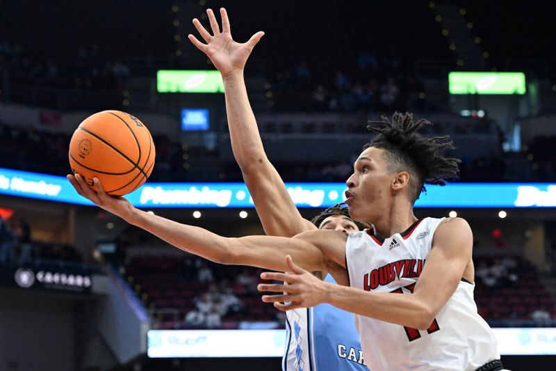 Jan 14, 2023; Louisville, Kentucky, USA;  Louisville Cardinals guard Fabio Basili (11) shoots against North Carolina Tar Heels guard Seth Trimble (0) during the second half at KFC Yum! Center. North Carolina defeated Louisville 80-59. Mandatory Credit: Jamie Rhodes-USA TODAY Sports