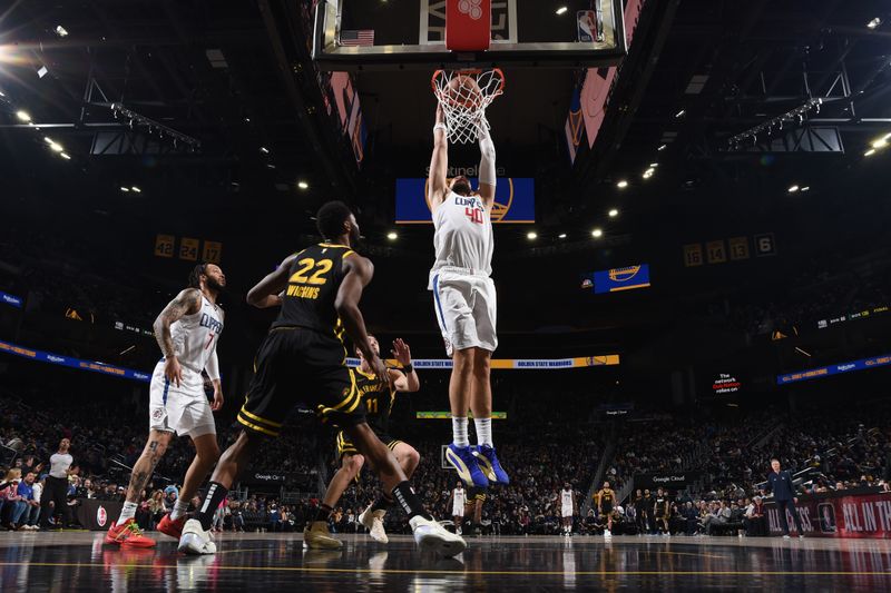 SAN FRANCISCO, CA - FEBRUARY 14: Ivica Zubac #40 of the LA Clippers dunks the ball during the game against the Golden State Warriors on FEBRUARY 14, 2024 at Chase Center in San Francisco, California. NOTE TO USER: User expressly acknowledges and agrees that, by downloading and or using this photograph, user is consenting to the terms and conditions of Getty Images License Agreement. Mandatory Copyright Notice: Copyright 2024 NBAE (Photo by Noah Graham/NBAE via Getty Images)