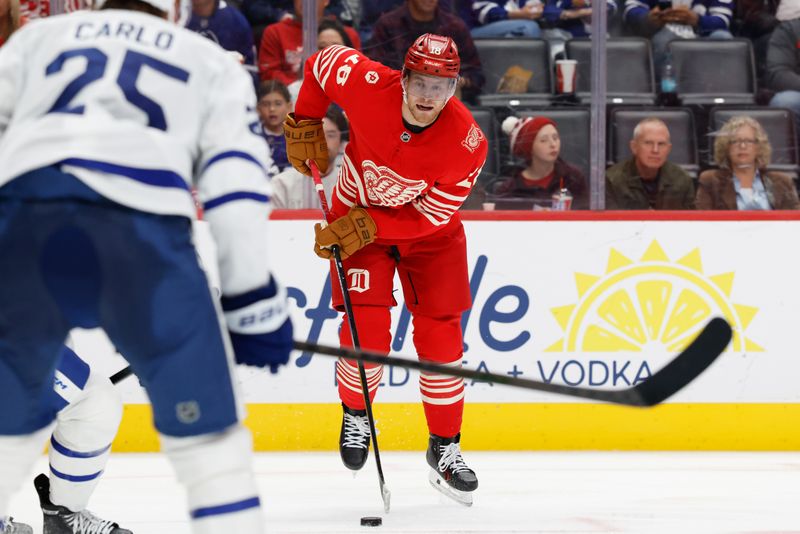 Oct 11, 2025; Detroit, Michigan, USA;  Detroit Red Wings center Andrew Copp (18) skates with the puck in the second period against the Toronto Maple Leafs at Little Caesars Arena. Mandatory Credit: Rick Osentoski-Imagn Images