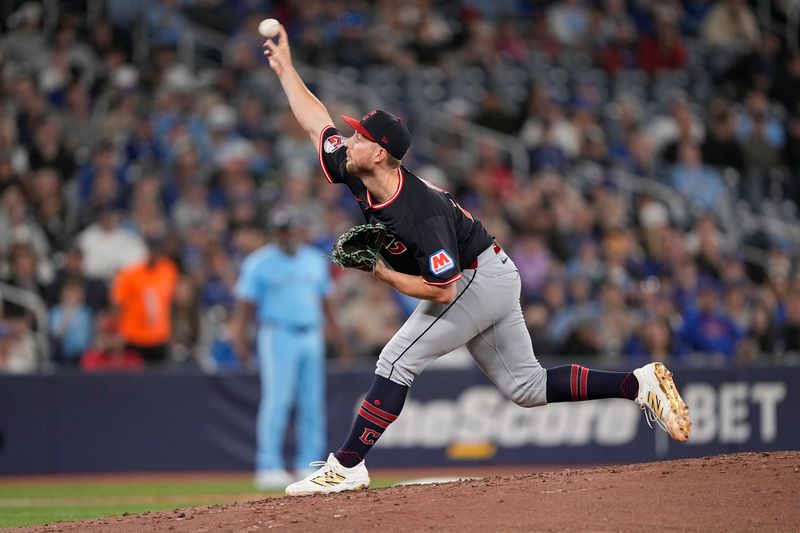 May 4, 2025; Toronto, Ontario, CAN; Cleveland Guardians starting pitcher Tanner Bibee (28) pitches to the Toronto Blue Jays during the third inning at Rogers Centre. Mandatory Credit: John E. Sokolowski-Imagn Images