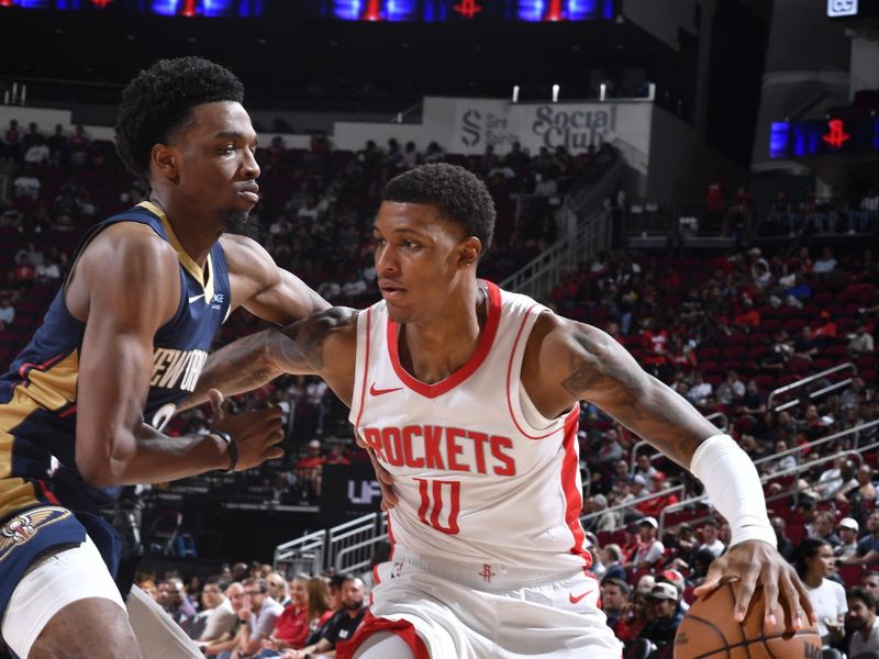 HOUSTON, TX - OCTOBER 15: Jabari Smith Jr. #10 of the Houston Rockets drives to the basket during the game against the New Orleans Pelicans during a NBA preseason game on October 15, 2024 at the Toyota Center in Houston, Texas. NOTE TO USER: User expressly acknowledges and agrees that, by downloading and or using this photograph, User is consenting to the terms and conditions of the Getty Images License Agreement. Mandatory Copyright Notice: Copyright 2024 NBAE (Photo by Logan Riely/NBAE via Getty Images)