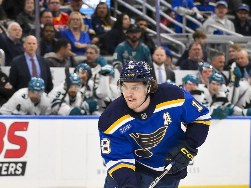 Nov 21, 2024; St. Louis, Missouri, USA;  St. Louis Blues center Robert Thomas (18) controls the puck against the San Jose Sharks during overtime at Enterprise Center. Mandatory Credit: Jeff Curry-Imagn Images