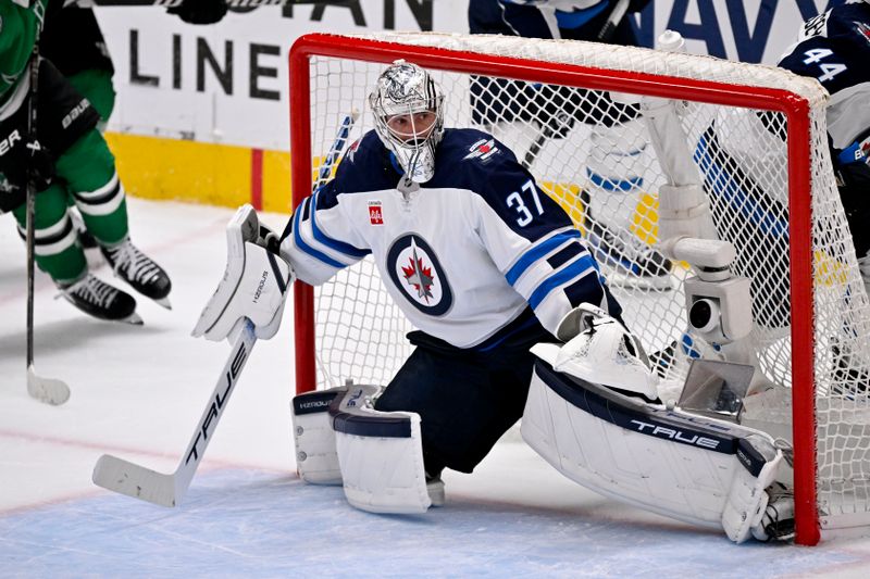 May 17, 2025; Dallas, Texas, USA; Winnipeg Jets goaltender Connor Hellebuyck (37) faces the Dallas Stars attack during the second period in game six of the second round of the 2025 Stanley Cup Playoffs at American Airlines Center. Mandatory Credit: Jerome Miron-Imagn Images