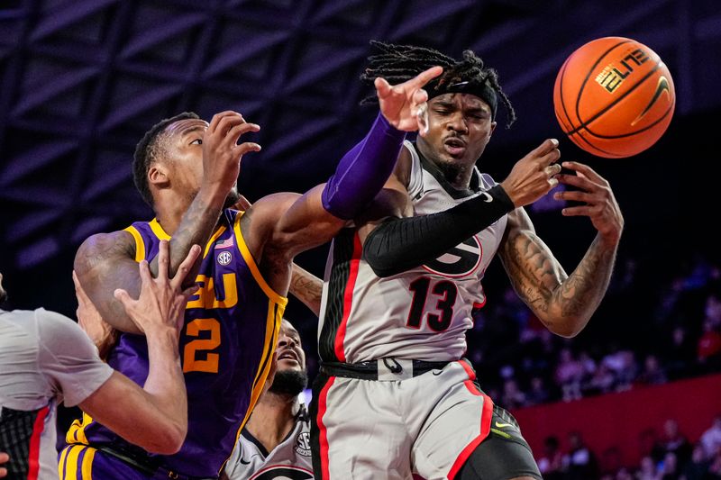 Feb 14, 2023; Athens, Georgia, USA; LSU Tigers forward KJ Williams (12) knocks the ball away from Georgia Bulldogs guard Mardrez McBride (13) during the first half at Stegeman Coliseum. Mandatory Credit: Dale Zanine-USA TODAY Sports