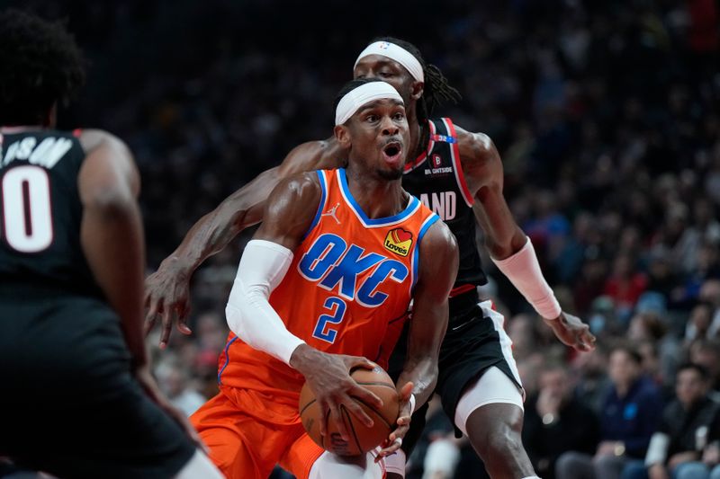 PORTLAND, OREGON - NOVEMBER 01: Shai Gilgeous-Alexander #2 of the Oklahoma City Thunder drives to the basket past Jerami Grant #9 of the Portland Trail Blazers during the first half at Moda Center on November 01, 2024 in Portland, Oregon. NOTE TO USER: User expressly acknowledges and agrees that, by downloading and or using this photograph, User is consenting to the terms and conditions of the Getty Images License Agreement. (Photo by Soobum Im/Getty Images)