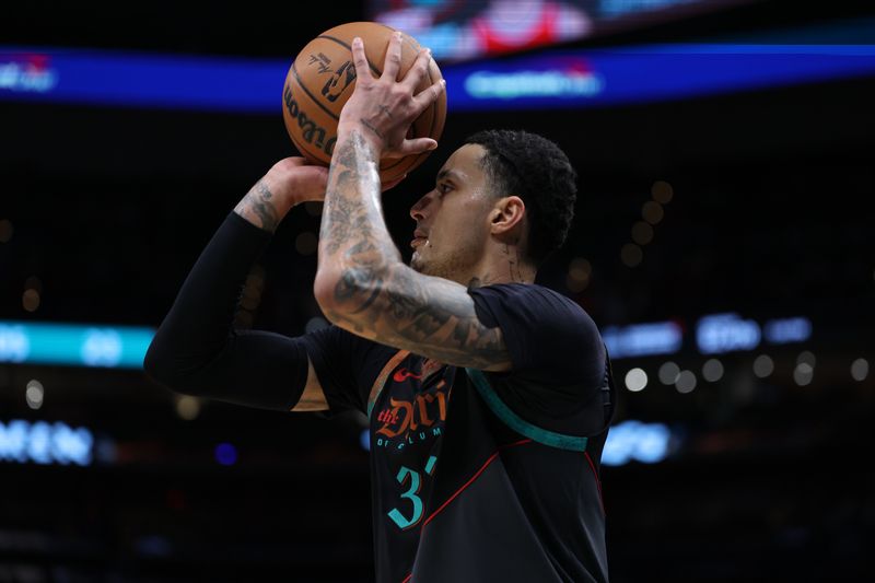 WASHINGTON, DC - FEBRUARY 02: Kyle Kuzma #33 of the Washington Wizards shoots against the Miami Heat during the first half at Capital One Arena on February 2, 2024 in Washington, DC. NOTE TO USER: User expressly acknowledges and agrees that, by downloading and or using this photograph, User is consenting to the terms and conditions of the Getty Images License Agreement. (Photo by Patrick Smith/Getty Images)