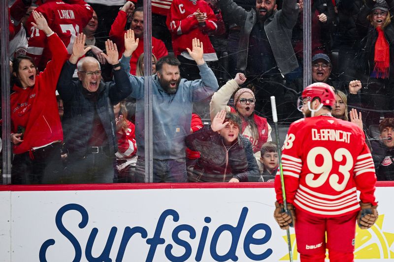 Nov 26, 2025; Detroit, Michigan, USA; Fans cheer as Detroit Red Wings right wing Alex DeBrincat (93) celebrates his goal during the second period against the Nashville Predators at Little Caesars Arena. Mandatory Credit: Tim Fuller-Imagn Images