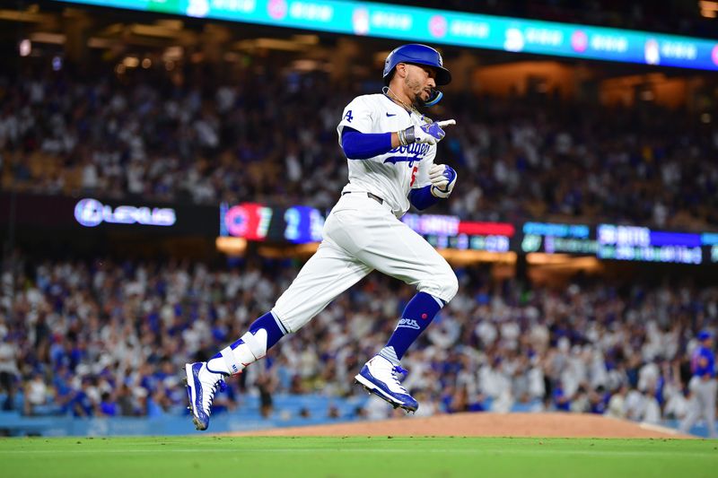 Sep 9, 2024; Los Angeles, California, USA; Los Angeles Dodgers right fielder Mookie Betts (50) runs after hitting a two run home run against the Chicago Cubs during the seventh inning at Dodger Stadium. Mandatory Credit: Gary A. Vasquez-Imagn Images