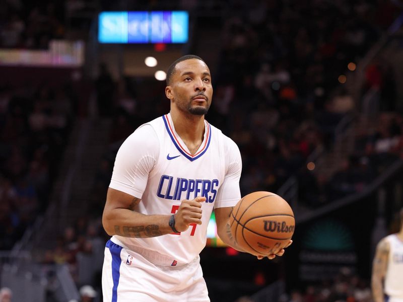 CLEVELAND, OH - JANUARY 29:  Norman Powell #24 of the LA Clippers shoots a free throw during the game on January 29, 2024 at Rocket Mortgage FieldHouse in Cleveland, Ohio. NOTE TO USER: User expressly acknowledges and agrees that, by downloading and/or using this Photograph, user is consenting to the terms and conditions of the Getty Images License Agreement. Mandatory Copyright Notice: Copyright 2024 NBAE (Photo by  Lauren Leigh Bacho/NBAE via Getty Images)