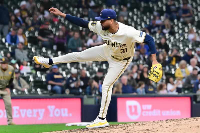 Apr 17, 2024; Milwaukee, Wisconsin, USA;  Milwaukee Brewers pitcher Joel Payamps (31) throws a pitch in the ninth inning against the San Diego Padres at American Family Field. Mandatory Credit: Benny Sieu-USA TODAY Sports