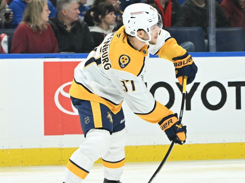 Jan 31, 2025; Buffalo, New York, USA; Nashville Predators defenseman Nick Blankenburg (37)shoots the puck in the second period against the Buffalo Sabres at the KeyBank Center. Mandatory Credit: Mark Konezny-Imagn Images