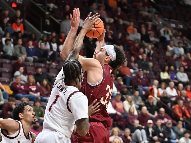 Mar 3, 2026; Blacksburg, Virginia, USA;  Boston College Eagles center Boden Kapke (33) attempts a shot as Virginia Tech Hokies forward Tobi Lawal (1) defends during the first half at Cassell Coliseum. Mandatory Credit: Brian Bishop-Imagn Images