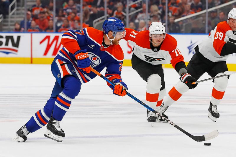 Oct 15, 2024; Edmonton, Alberta, CAN; Edmonton Oilers defensemen Brett Kulak (27)  looks to make a pass in front of Philadelphia Flyers forward Tyson Foerster (71) during the first period at Rogers Place. Mandatory Credit: Perry Nelson-Imagn Images