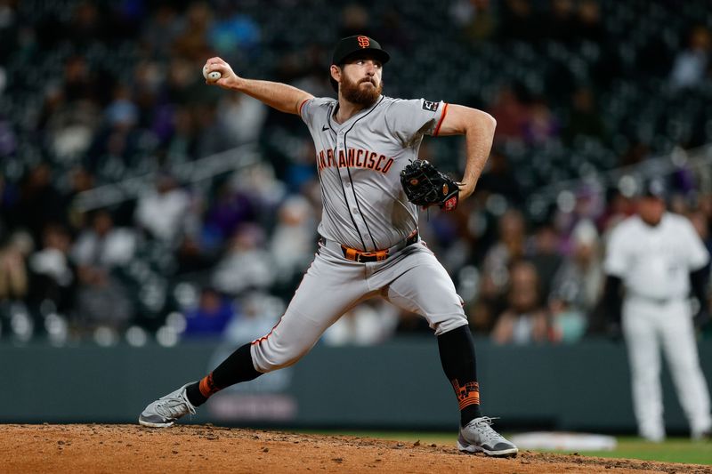 May 7, 2024; Denver, Colorado, USA; San Francisco Giants relief pitcher Ryan Walker (74) pitches in the eighth inning against the Colorado Rockies at Coors Field. Mandatory Credit: Isaiah J. Downing-USA TODAY Sports