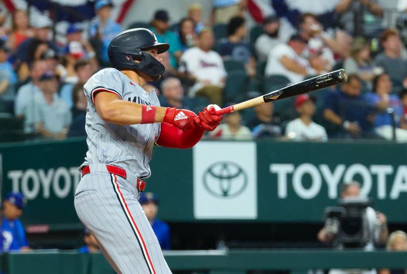 Aug 17, 2024; Arlington, Texas, USA;  Minnesota Twins left fielder Trevor Larnach (9) hits a home run during the fourth inning against the Texas Rangers at Globe Life Field. Mandatory Credit: Kevin Jairaj-USA TODAY Sports