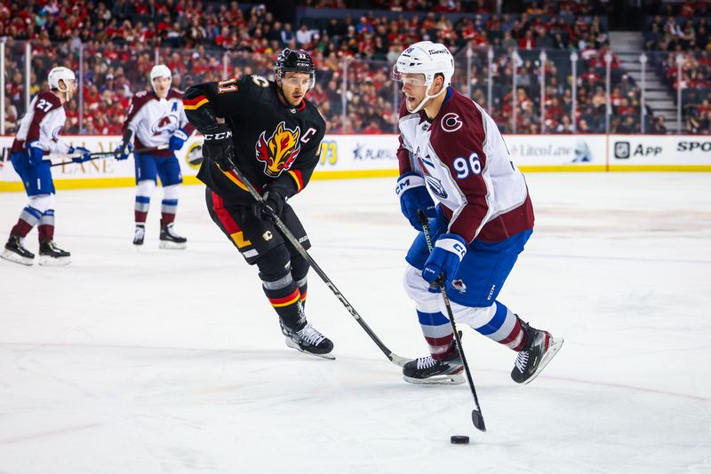 Mar 12, 2024; Calgary, Alberta, CAN; Colorado Avalanche right wing Mikko Rantanen (96) controls the puck against the Calgary Flames during the first period at Scotiabank Saddledome. Mandatory Credit: Sergei Belski-USA TODAY Sports