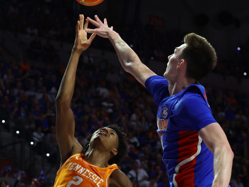 Feb 1, 2023; Gainesville, Florida, USA; Florida Gators forward Colin Castleton (12) defends Tennessee Volunteers forward Julian Phillips (2) during the second half at Exactech Arena at the Stephen C. O'Connell Center. Mandatory Credit: Kim Klement-USA TODAY Sports