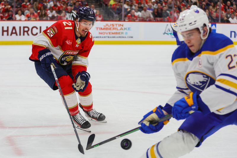 Apr 13, 2024; Sunrise, Florida, USA; Florida Panthers center Nick Cousins (21) battle for the puck against Buffalo Sabres right wing Jack Quinn (22) during the second period at Amerant Bank Arena. Mandatory Credit: Sam Navarro-USA TODAY Sports
