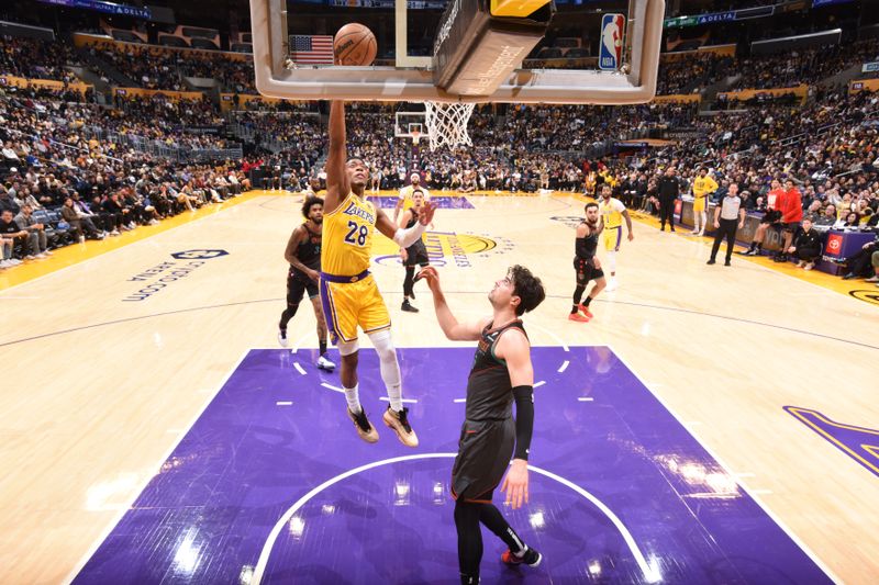 LOS ANGELES, CA - FEBRUARY 29: Rui Hachimura #28 of the Los Angeles Lakers drives to the basket during the game against the Washington Wizards on February 29, 2024 at Crypto.Com Arena in Los Angeles, California. NOTE TO USER: User expressly acknowledges and agrees that, by downloading and/or using this Photograph, user is consenting to the terms and conditions of the Getty Images License Agreement. Mandatory Copyright Notice: Copyright 2024 NBAE (Photo by Andrew D. Bernstein/NBAE via Getty Images)