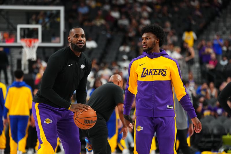 LAS VEGAS, NV - OCTOBER 15: LeBron James #23 and Bronny James #9 of the Los Angeles Lakers warms up before the game before the game against the Golden State Warriors during the 2024 NBA Preseason on October 15, 2024 at T-Mobile Arena in Las Vegas, Nevada. NOTE TO USER: User expressly acknowledges and agrees that, by downloading and or using this photograph, User is consenting to the terms and conditions of the Getty Images License Agreement. Mandatory Copyright Notice: Copyright 2024 NBAE  (Photo by Jeff Bottari/NBAE via Getty Images)