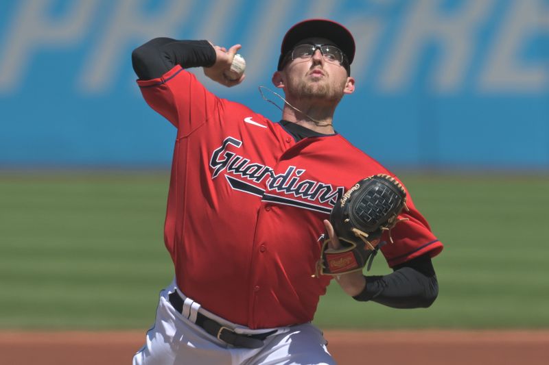 Apr 26, 2023; Cleveland, Ohio, USA; Cleveland Guardians starting pitcher Tanner Bibee (61) throws a pitch during the first inning against the Colorado Rockies at Progressive Field. Mandatory Credit: Ken Blaze-USA TODAY Sports