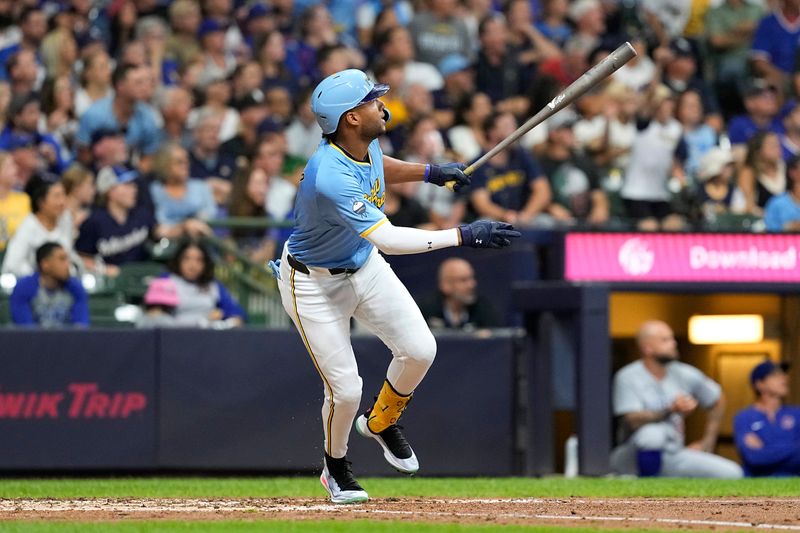 Jun 28, 2024; Milwaukee, Wisconsin, USA;  Milwaukee Brewers right fielder Jackson Chourio (11) hits a grand slam home run during the fourth inning against the Chicago Cubs at American Family Field. Mandatory Credit: Jeff Hanisch-USA TODAY Sports