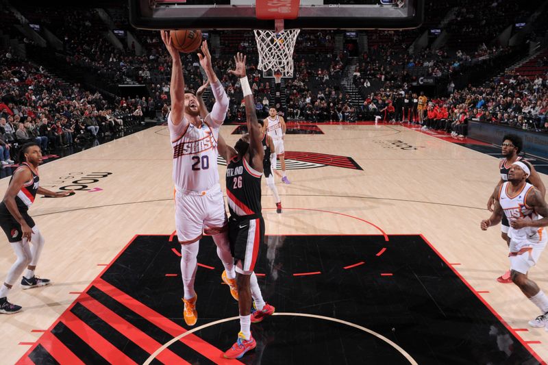 PORTLAND, OR - JANUARY 14: Jusuf Nurkic #20 of the Phoenix Suns drives to the basket during the game against the Portland Trail Blazers on January 14, 2024 at the Moda Center Arena in Portland, Oregon. NOTE TO USER: User expressly acknowledges and agrees that, by downloading and or using this photograph, user is consenting to the terms and conditions of the Getty Images License Agreement. Mandatory Copyright Notice: Copyright 2024 NBAE (Photo by Cameron Browne/NBAE via Getty Images)