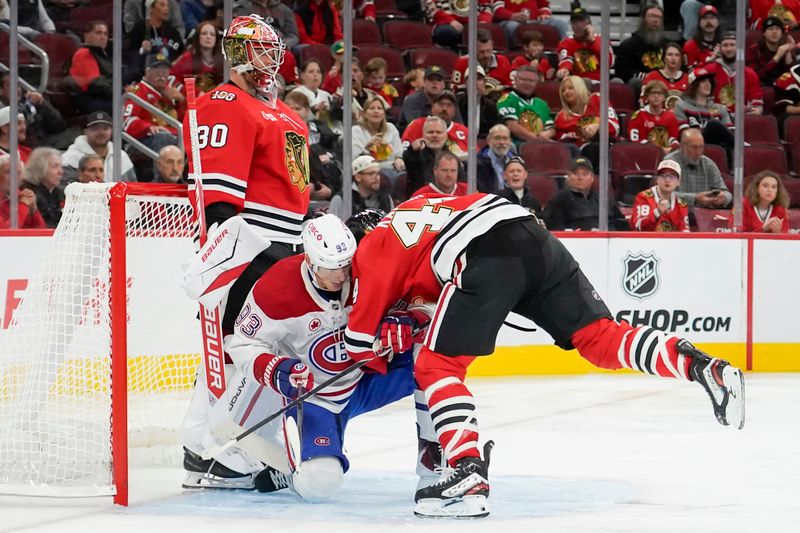 Oct 11, 2025; Chicago, Illinois, USA; Chicago Blackhawks defenseman Wyatt Kaiser (44) checks Montréal Canadiens right wing Ivan Demidov (93) during the second period at United Center. Mandatory Credit: David Banks-Imagn Images