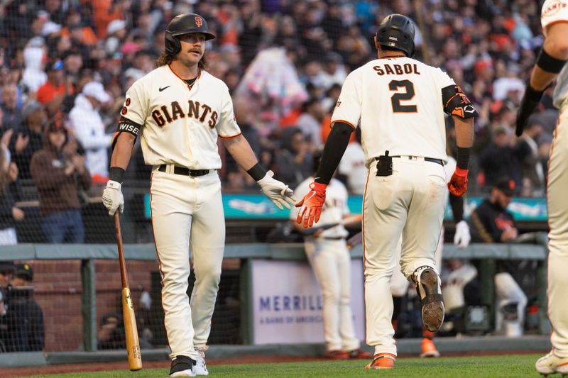 Jul 3, 2023; San Francisco, California, USA;  San Francisco Giants catcher Blake Sabol (2) celebrates with second baseman Brett Wisely (70) after hitting a two run home run during the fourth inning against the Seattle Mariners at Oracle Park. Mandatory Credit: Stan Szeto-USA TODAY Sports