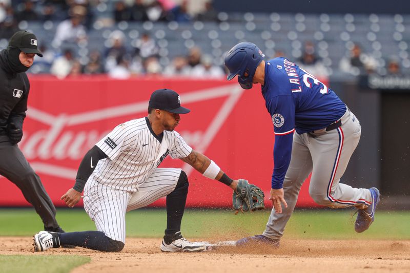 May 22, 2025; Bronx, New York, USA; New York Yankees starting pitcher Clarke Schmidt (36) steals second base, beating the tag by New York Yankees second baseman Jorbit Vivas (90) during the sixth inning at Yankee Stadium. Mandatory Credit: Vincent Carchietta-Imagn Images