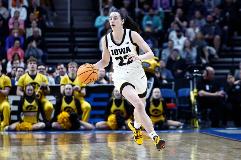 Apr 1, 2024; Albany, NY, USA; Iowa Hawkeyes guard Caitlin Clark (22) controls the ball in the first half against the LSU Lady Tigers in the finals of the Albany Regional in the 2024 NCAA Tournament at MVP Arena. Mandatory Credit: Winslow Townson-USA TODAY Sports