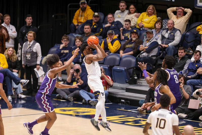 Feb 25, 2025; Morgantown, West Virginia, USA; West Virginia Mountaineers guard Joseph Yesufu (1) shoots a jumper during the second half against the TCU Horned Frogs at WVU Coliseum. Mandatory Credit: Ben Queen-Imagn Images