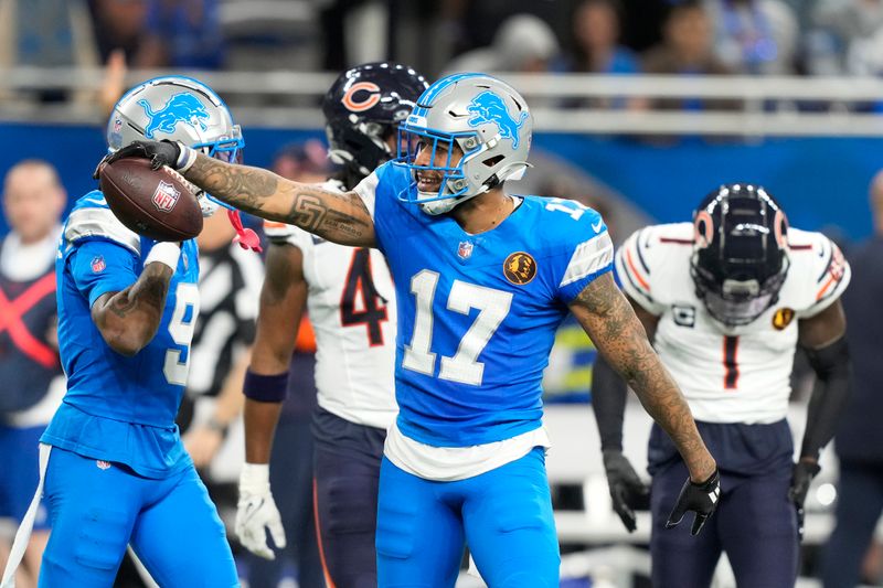 Detroit Lions wide receiver Tim Patrick (17) signals a first down after a reception against the Chicago Bears during the first half of an NFL football game, Sunday, Nov. 17, 2024, in Detroit. (AP Photo/Carlos Osorio)