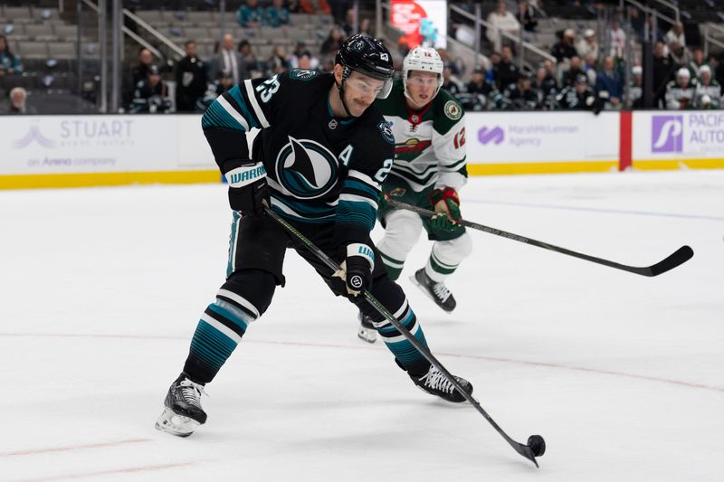 Nov 7, 2024; San Jose, California, USA;  San Jose Sharks right wing Barclay Goodrow (23) controls the puck during the first period against the Minnesota Wild at SAP Center at San Jose. Mandatory Credit: Stan Szeto-Imagn Images