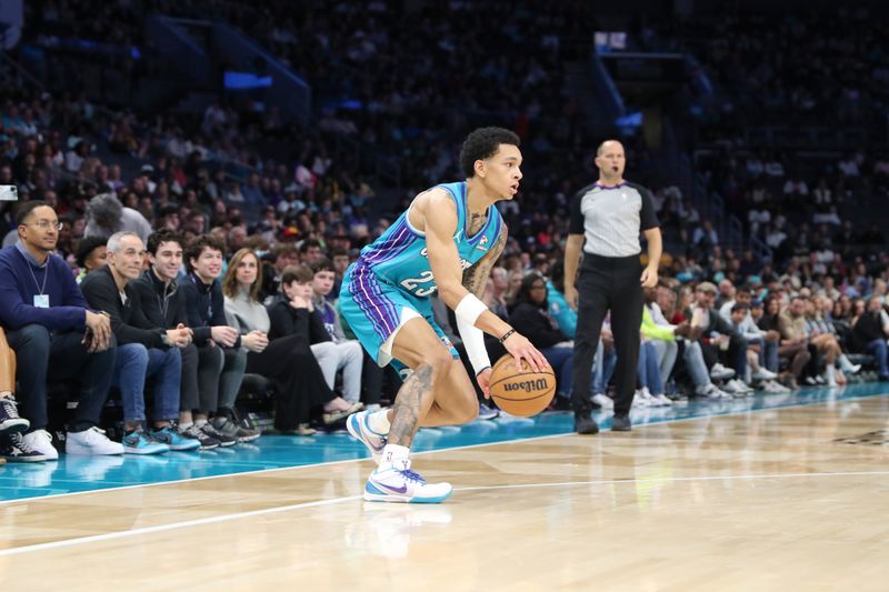 CHARLOTTE, NC - FEBRUARY 10:  Tre Mann #23 of the  Charlotte Hornets handles the ball during the game  on February 10, 2024 at Spectrum Center in Charlotte, North Carolina. NOTE TO USER: User expressly acknowledges and agrees that, by downloading and or using this photograph, User is consenting to the terms and conditions of the Getty Images License Agreement.  Mandatory Copyright Notice:  Copyright 2024 NBAE (Photo by Brock Williams-Smith/NBAE via Getty Images)