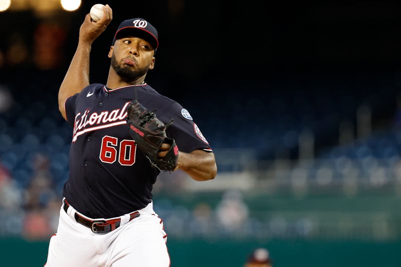 Sep 18, 2023; Washington, District of Columbia, USA; Washington Nationals starting pitcher Joan Adon (60) pitches against the Chicago White Sox during the first inning at Nationals Park. Mandatory Credit: Geoff Burke-USA TODAY Sports