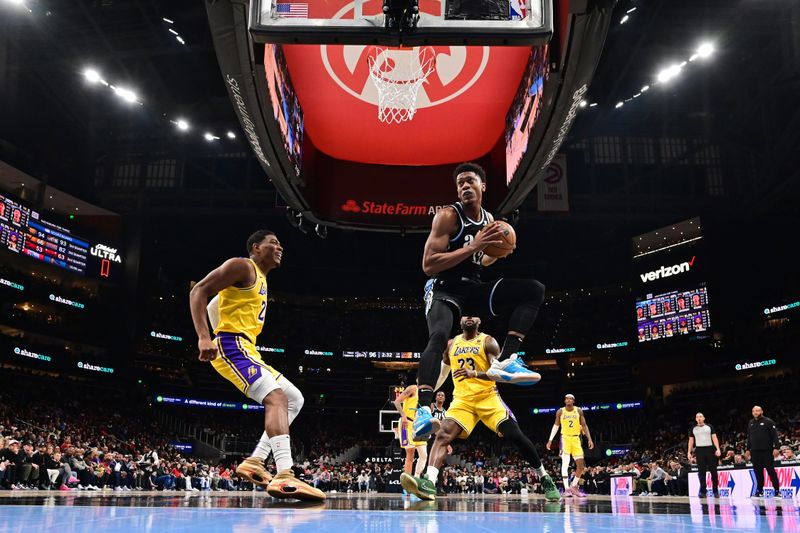 ATLANTA, GA - JANUARY 30: De'Andre Hunter #12 of the Atlanta Hawks grabs a rebound during the game against the Los Angeles Lakers on January 30, 2024 at State Farm Arena in Atlanta, Georgia.  NOTE TO USER: User expressly acknowledges and agrees that, by downloading and/or using this Photograph, user is consenting to the terms and conditions of the Getty Images License Agreement. Mandatory Copyright Notice: Copyright 2024 NBAE (Photo by Adam Hagy/NBAE via Getty Images)